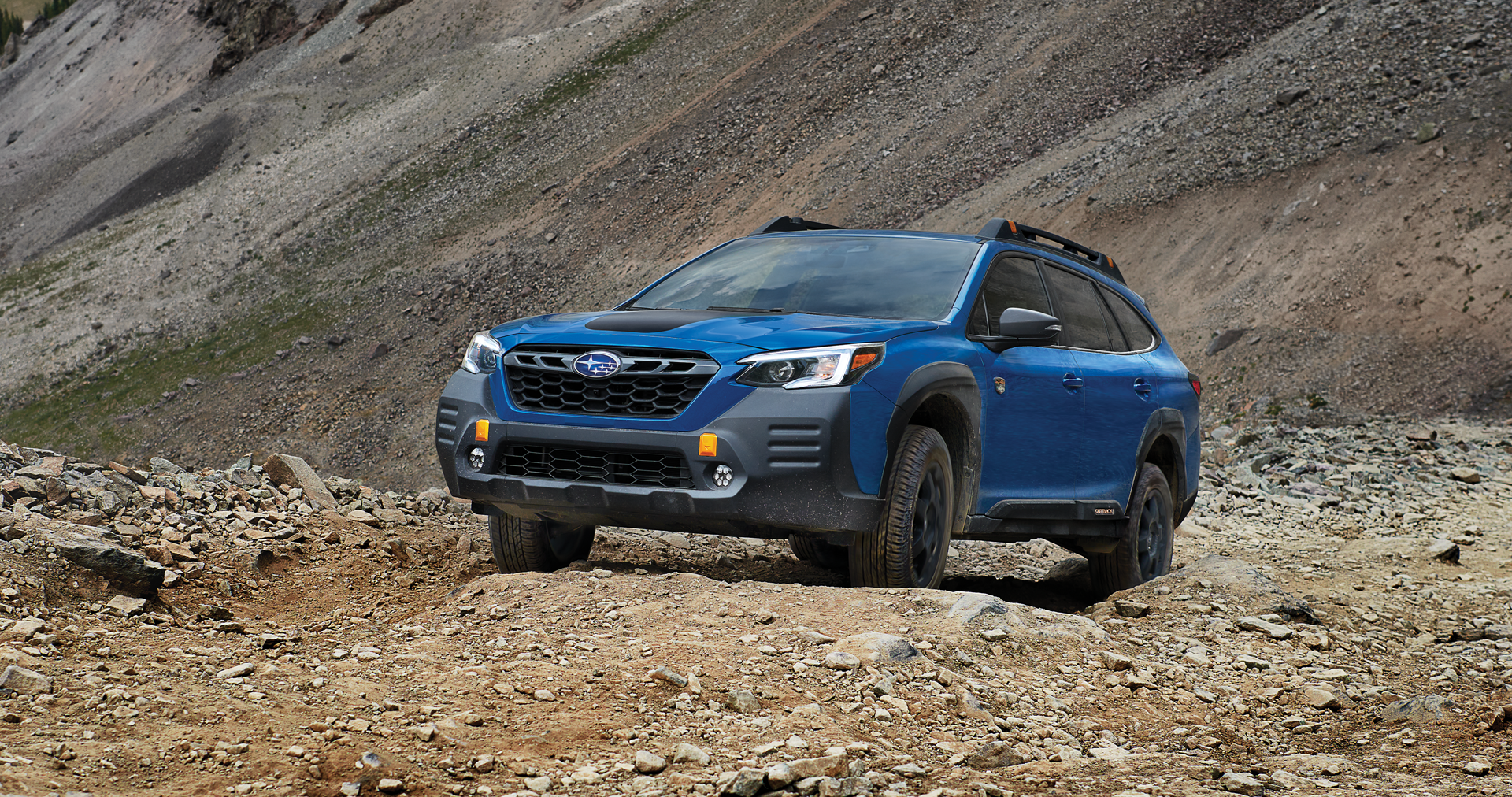 A 2023 Outback Wilderness driving on a trail in the mountains. | Fuccillo Subaru in Watertown NY