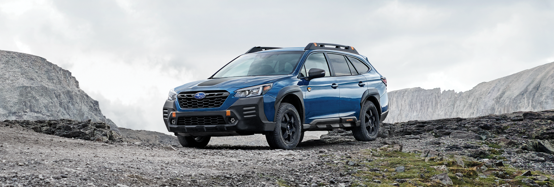 A 2023 Outback Wilderness parked in the mountains. | Fuccillo Subaru in Watertown NY